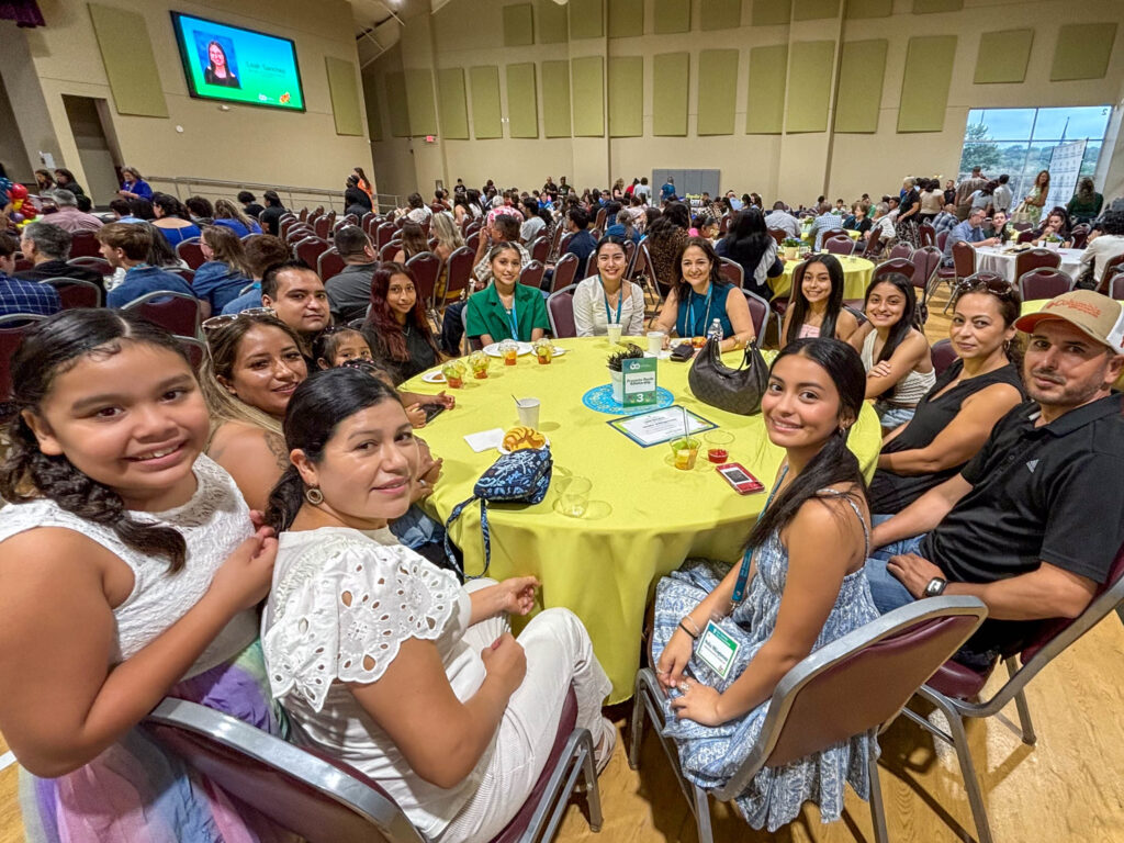 Scholarship Students sitting at table